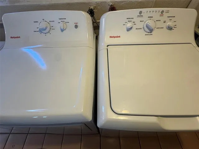 a white refrigerator freezer sitting inside of a kitchen