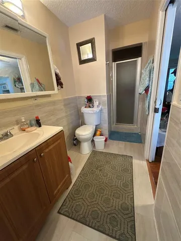 a living room with furniture and a mirror