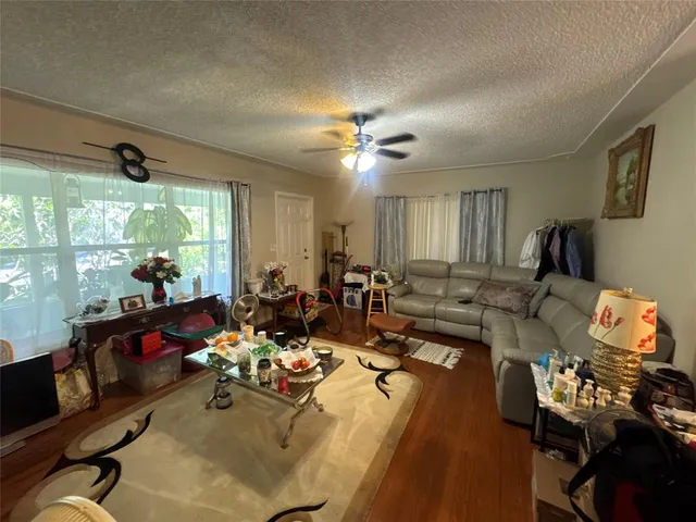 a very nice looking living room with furniture and a large window