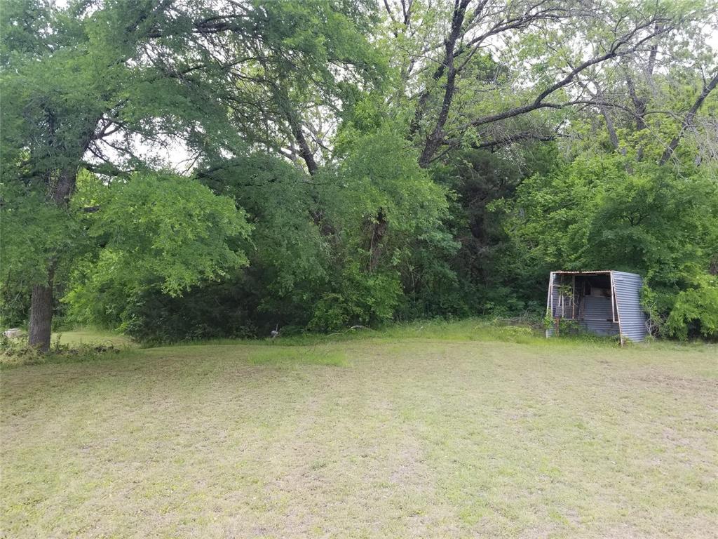 5808 President George Bush Highway Rowlett, TX 75089 - Photo 3 of 10 a backyard of a house with table and chairs