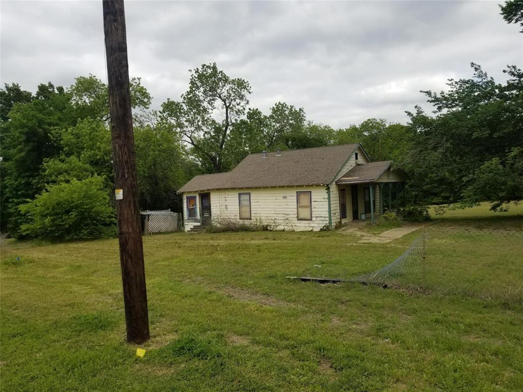 5808 President George Bush Highway Rowlett, TX 75089 - Photo 6 of 10 a front view of a house with garden