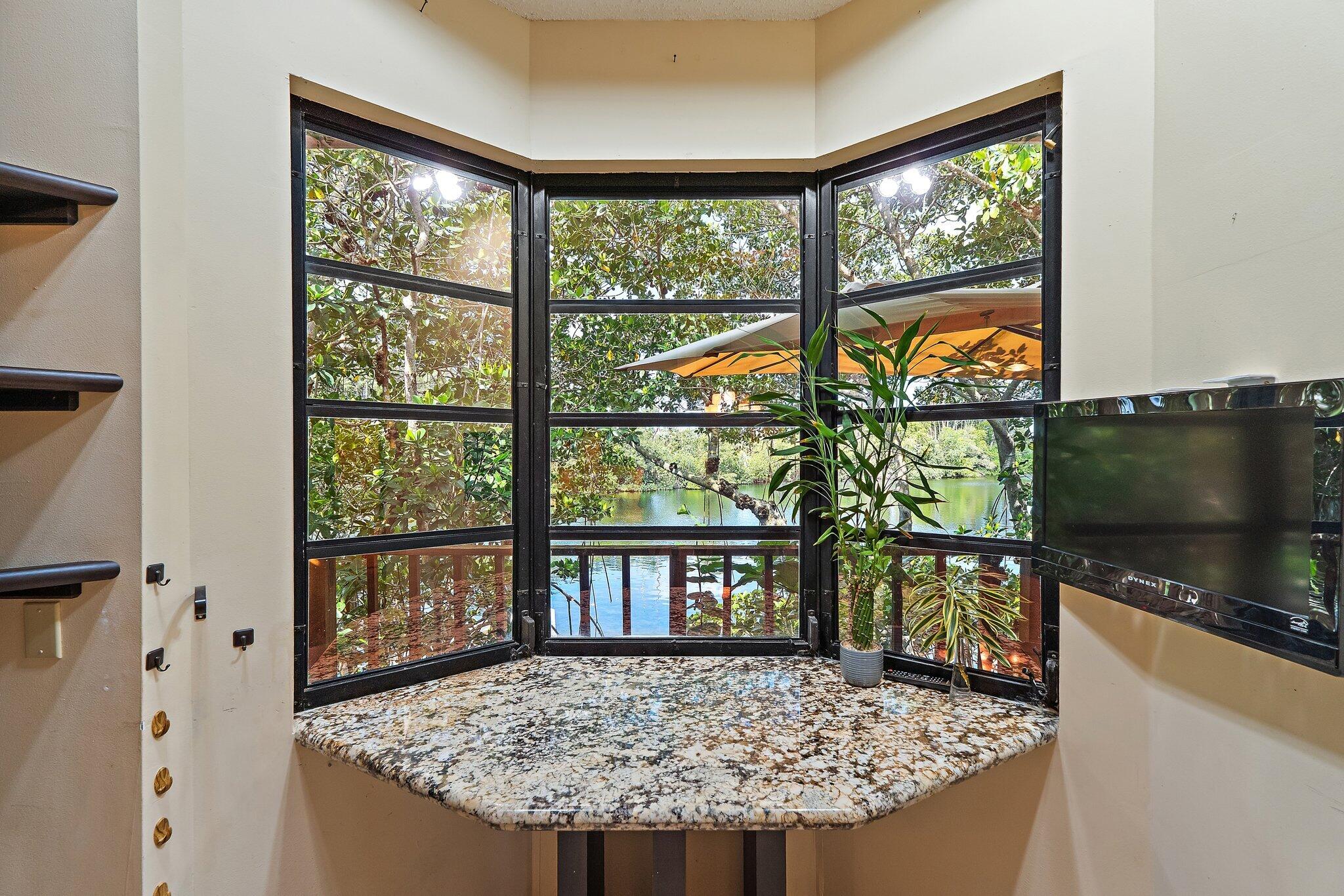 702 Warren Drive Jupiter, FL 33458 - Photo 42 of 76 a view of a living room and window