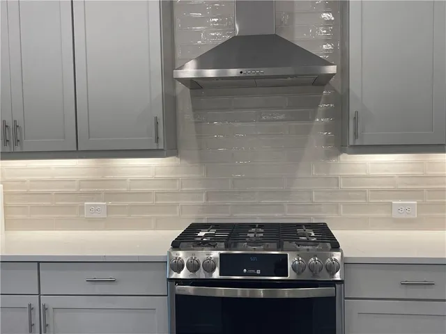 a kitchen with a sink and stove