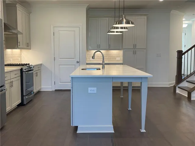 an empty room with a ceiling fan and window