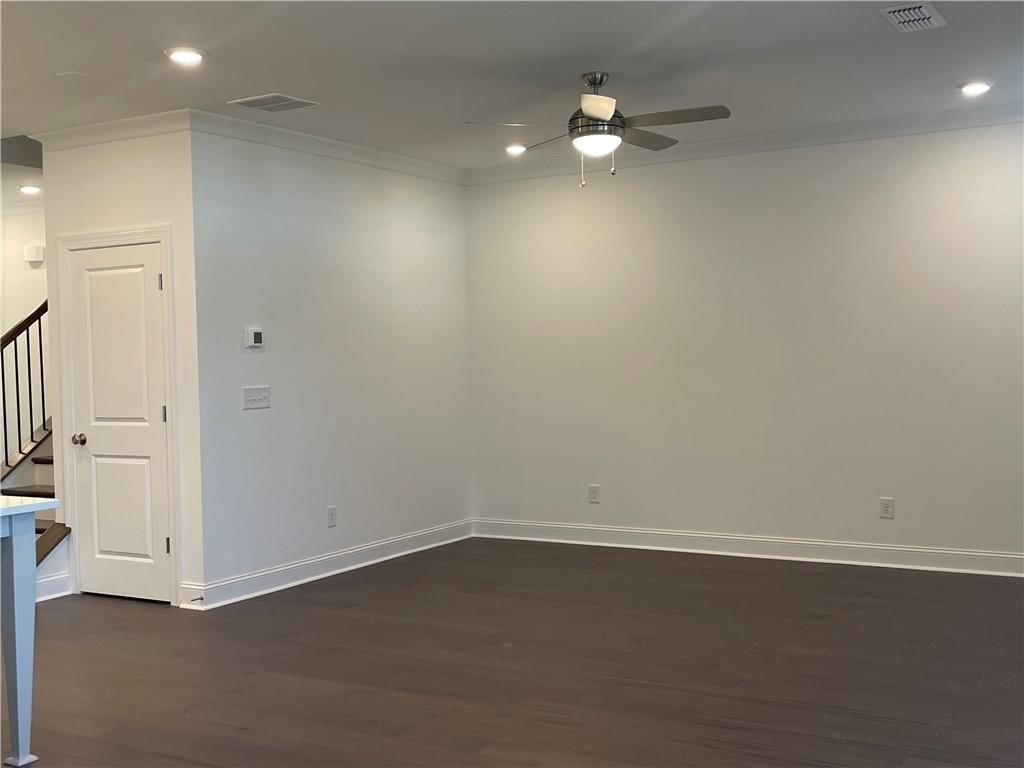 4807 Larkin Pass Buford, GA 30518 - Photo 18 of 58 an empty room with a ceiling fan and window