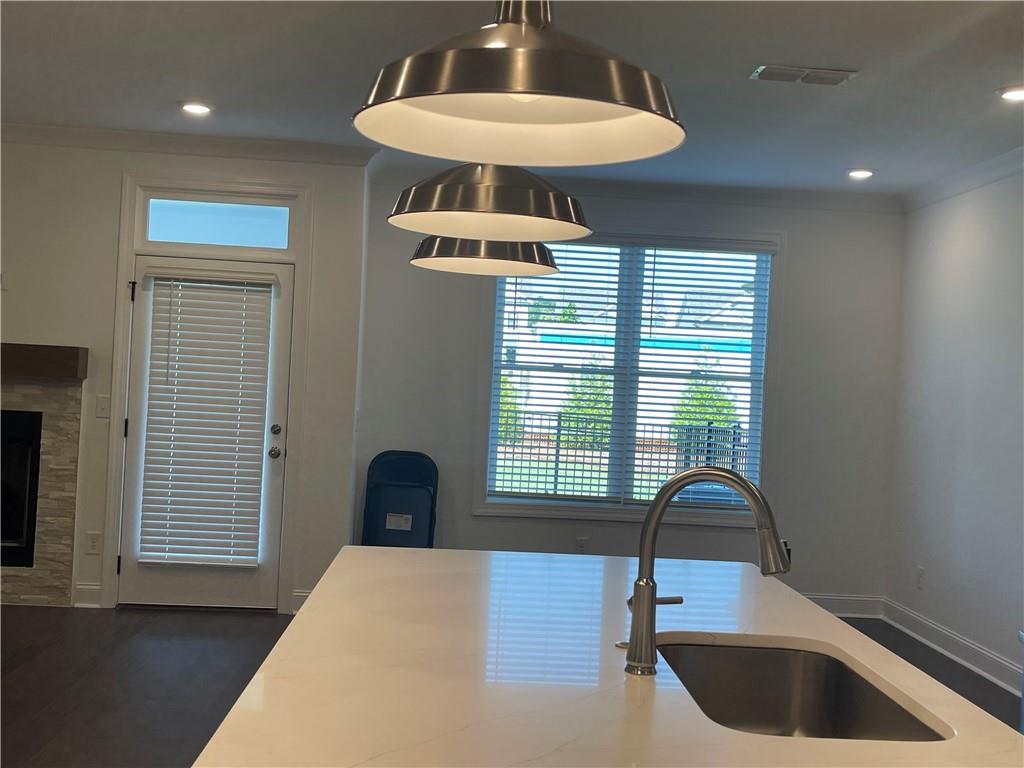 4807 Larkin Pass Buford, GA 30518 - Photo 23 of 58 a kitchen with a sink cabinets and window