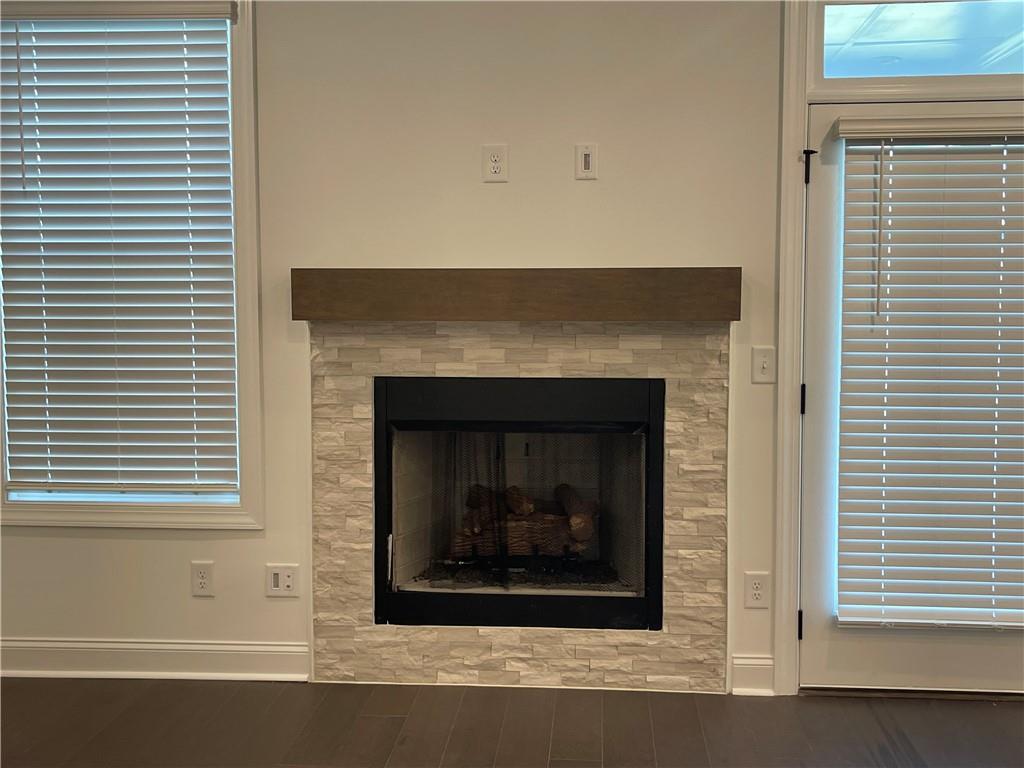 4807 Larkin Pass Buford, GA 30518 - Photo 26 of 58 a white building with a fireplace