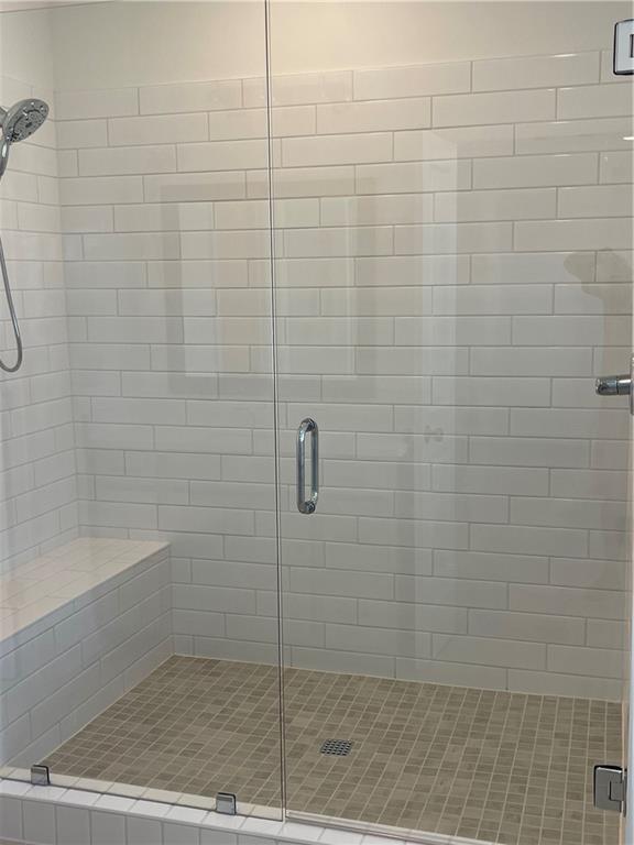 4807 Larkin Pass Buford, GA 30518 - Photo 35 of 58 a bathroom with a shower