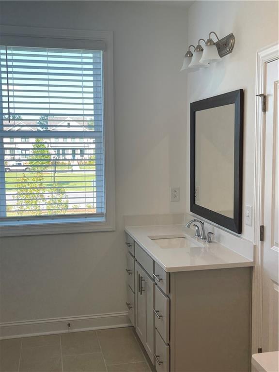 4807 Larkin Pass Buford, GA 30518 - Photo 36 of 58 a bathroom with a sink and a mirror