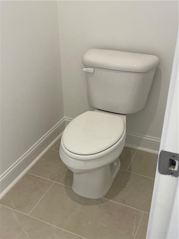 4807 Larkin Pass Buford, GA 30518 - Photo 41 of 58 a white toilet sitting next to a white tub