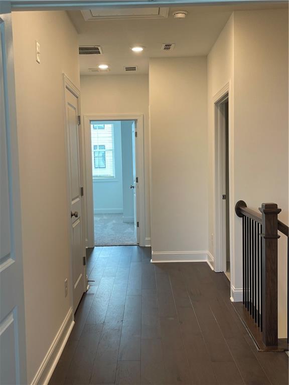 4807 Larkin Pass Buford, GA 30518 - Photo 43 of 58 a view of a hallway with wooden floor