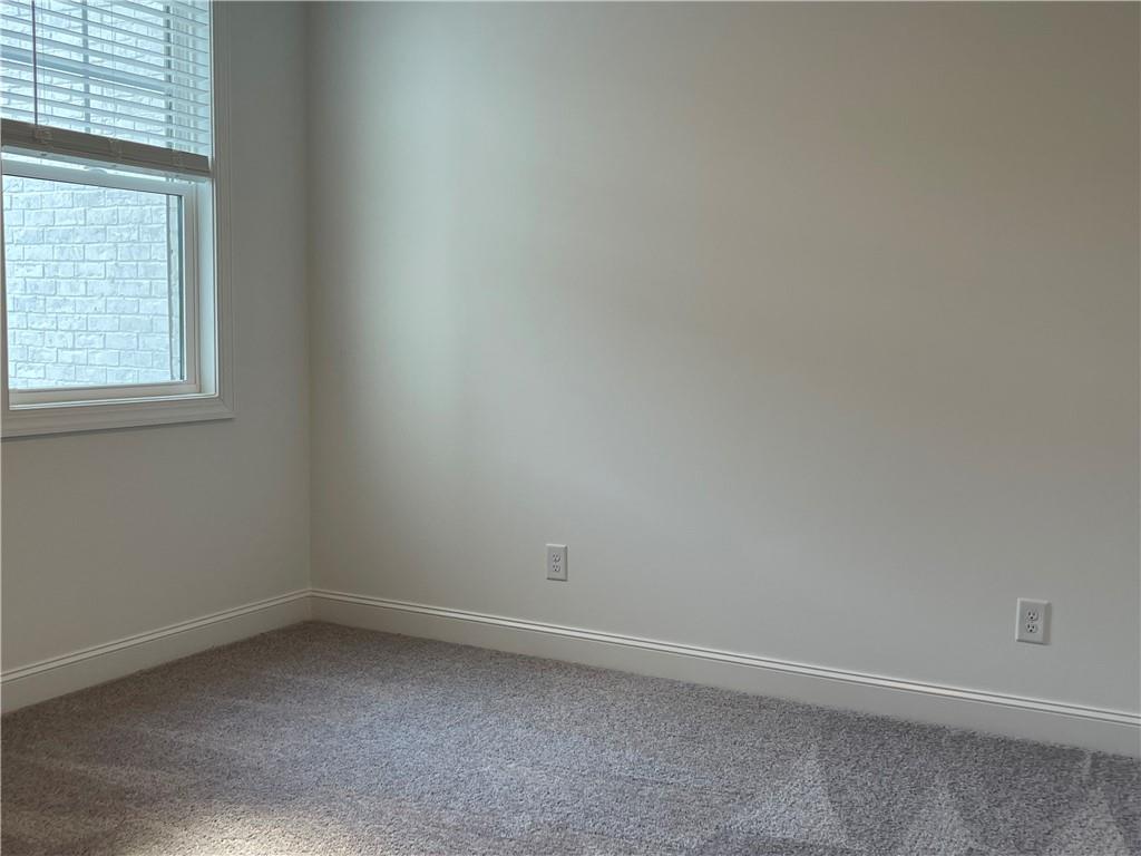 4807 Larkin Pass Buford, GA 30518 - Photo 47 of 58 an empty room with a window