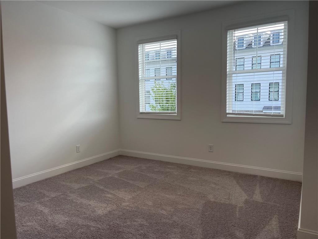 4807 Larkin Pass Buford, GA 30518 - Photo 48 of 58 an empty room with windows