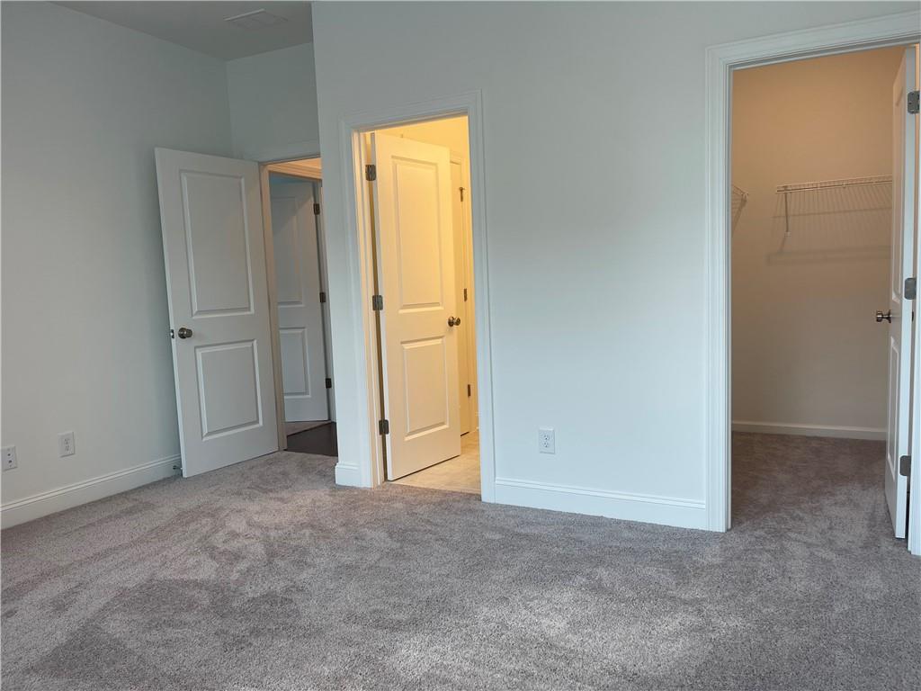 4807 Larkin Pass Buford, GA 30518 - Photo 49 of 58 an empty room with windows