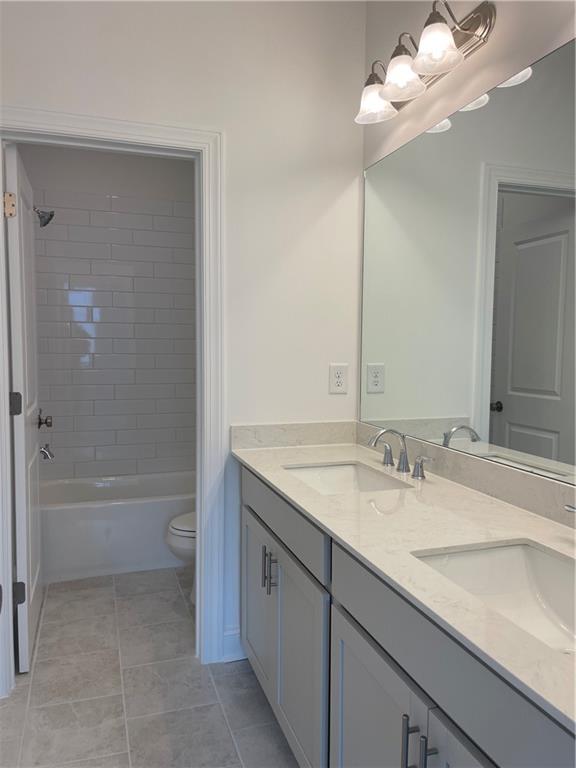 4807 Larkin Pass Buford, GA 30518 - Photo 50 of 58 a bathroom with a sink a toilet and bathtub