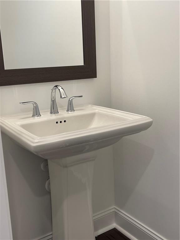 4807 Larkin Pass Buford, GA 30518 - Photo 6 of 58 a bathroom with a sink and a mirror