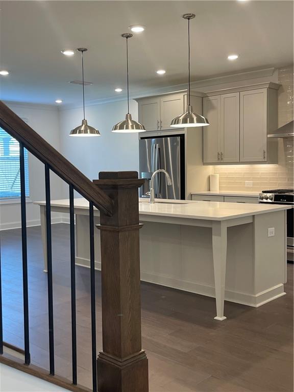 4807 Larkin Pass Buford, GA 30518 - Photo 7 of 58 a kitchen with kitchen island a large counter top a appliances and cabinets