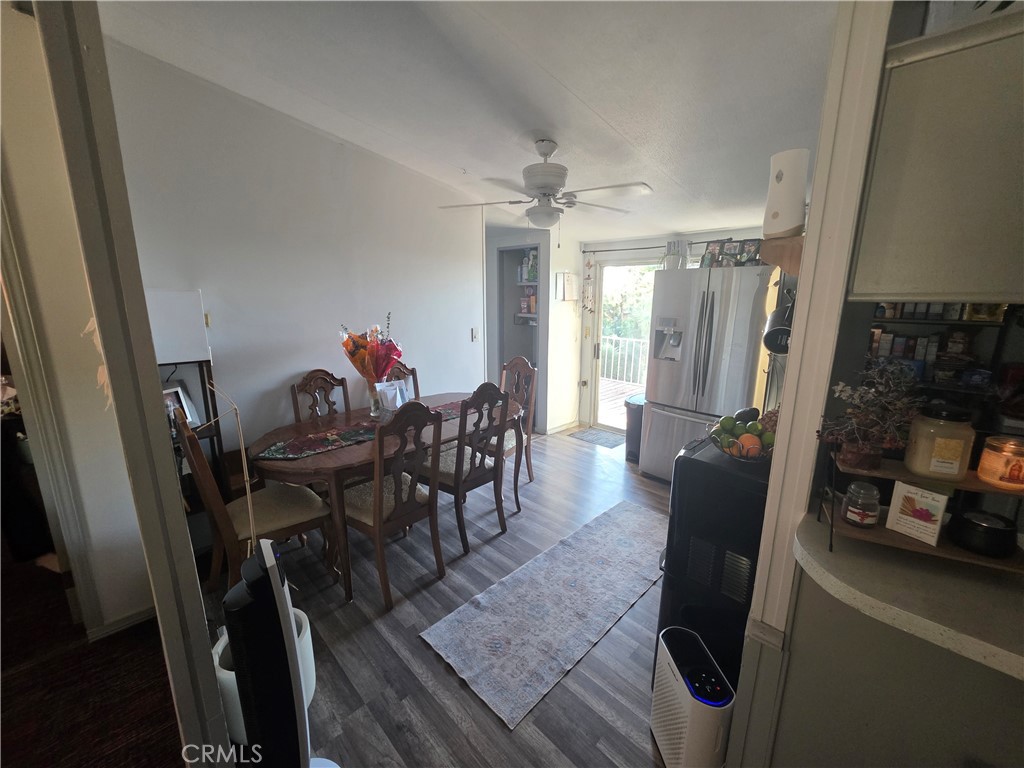 10623 Desert View Road Pinon Hills, CA 92372 - Photo 52 of 76 a view of a dining room with furniture window and wooden floor