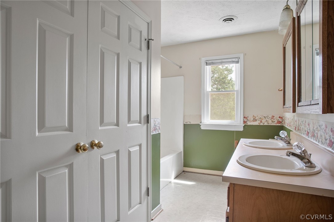 3800 Bailey Farm Road Moseley, VA 23120 - Photo 21 of 48 a bathroom with a sink a toilet and a mirror
