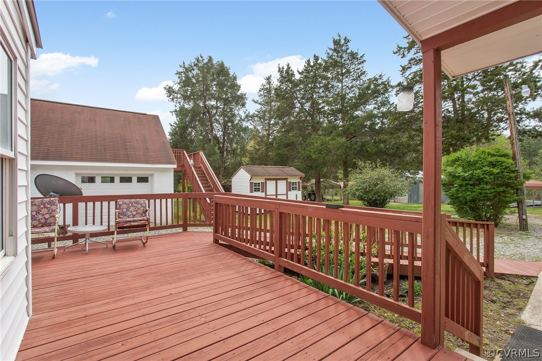 3800 Bailey Farm Road Moseley, VA 23120 - Photo 24 of 48 a view of a wooden deck with a bench