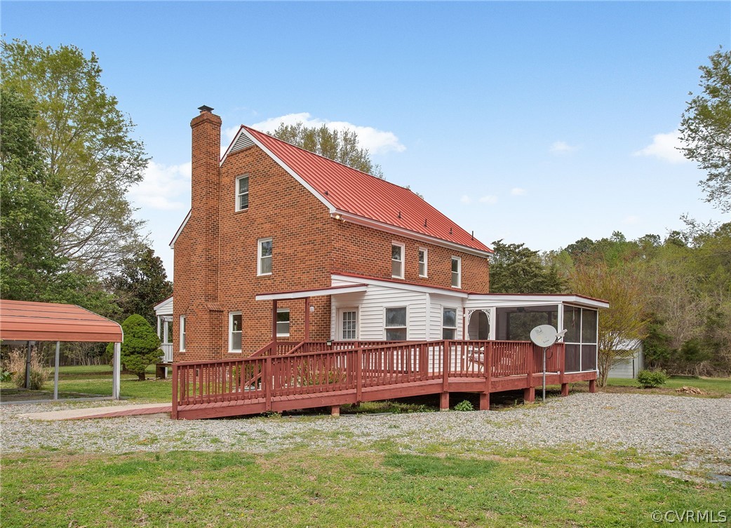 3800 Bailey Farm Road Moseley, VA 23120 - Photo 27 of 48 a view of a house with a wooden deck and a yard