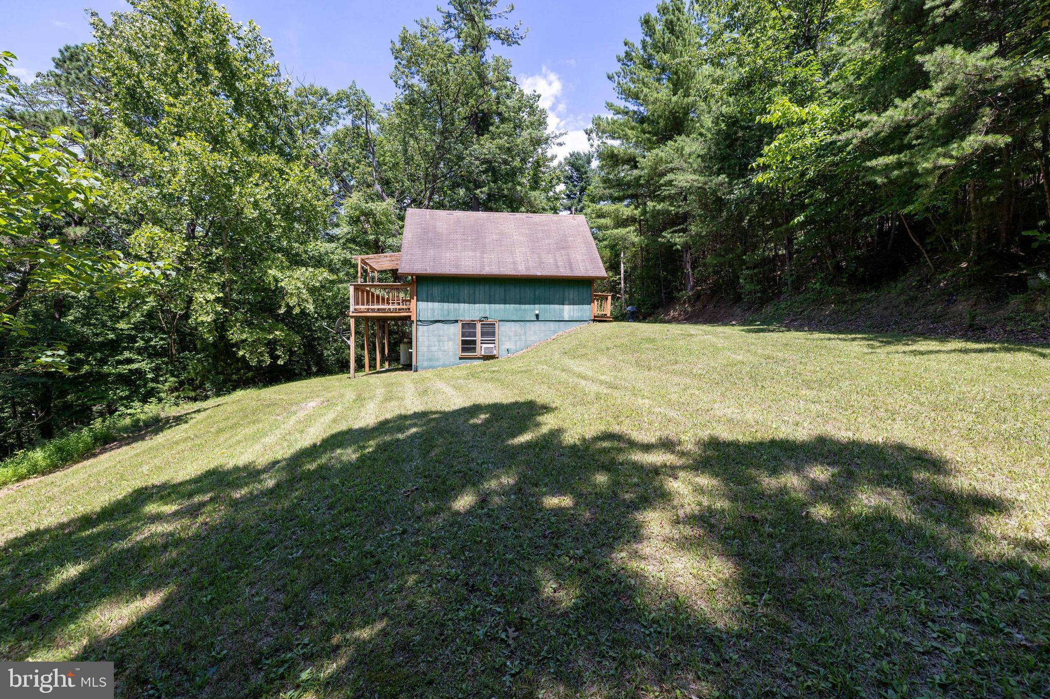 1247 Somers Road Luray, VA 22835 - Photo 47 of 67 a backyard of a house with table and chairs