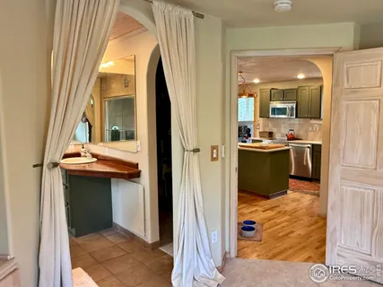 a kitchen view with a sink and refrigerator