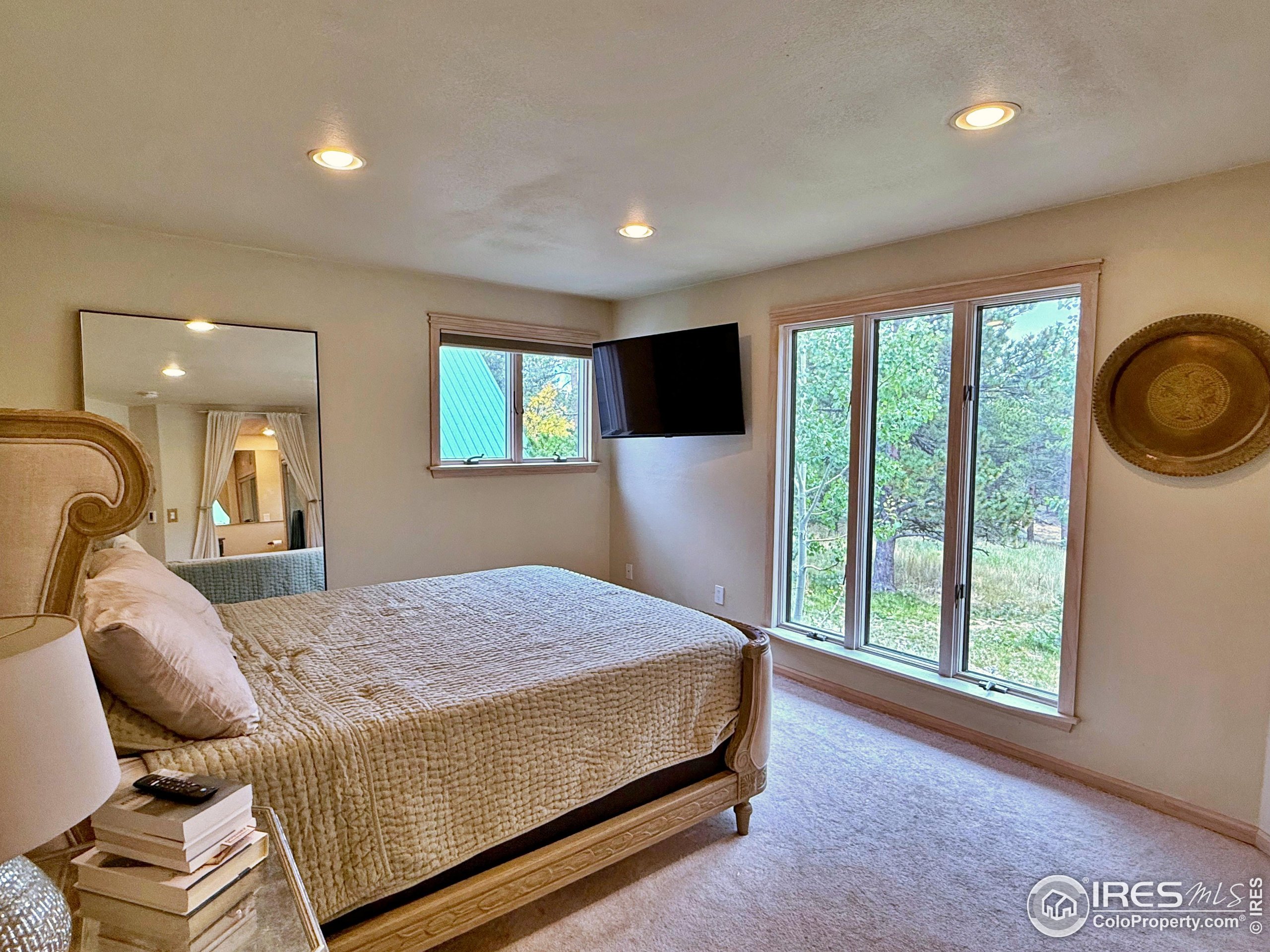 84 Ranch Road Ward, CO 80481 - Photo 14 of 45 a bedroom with a bed and window