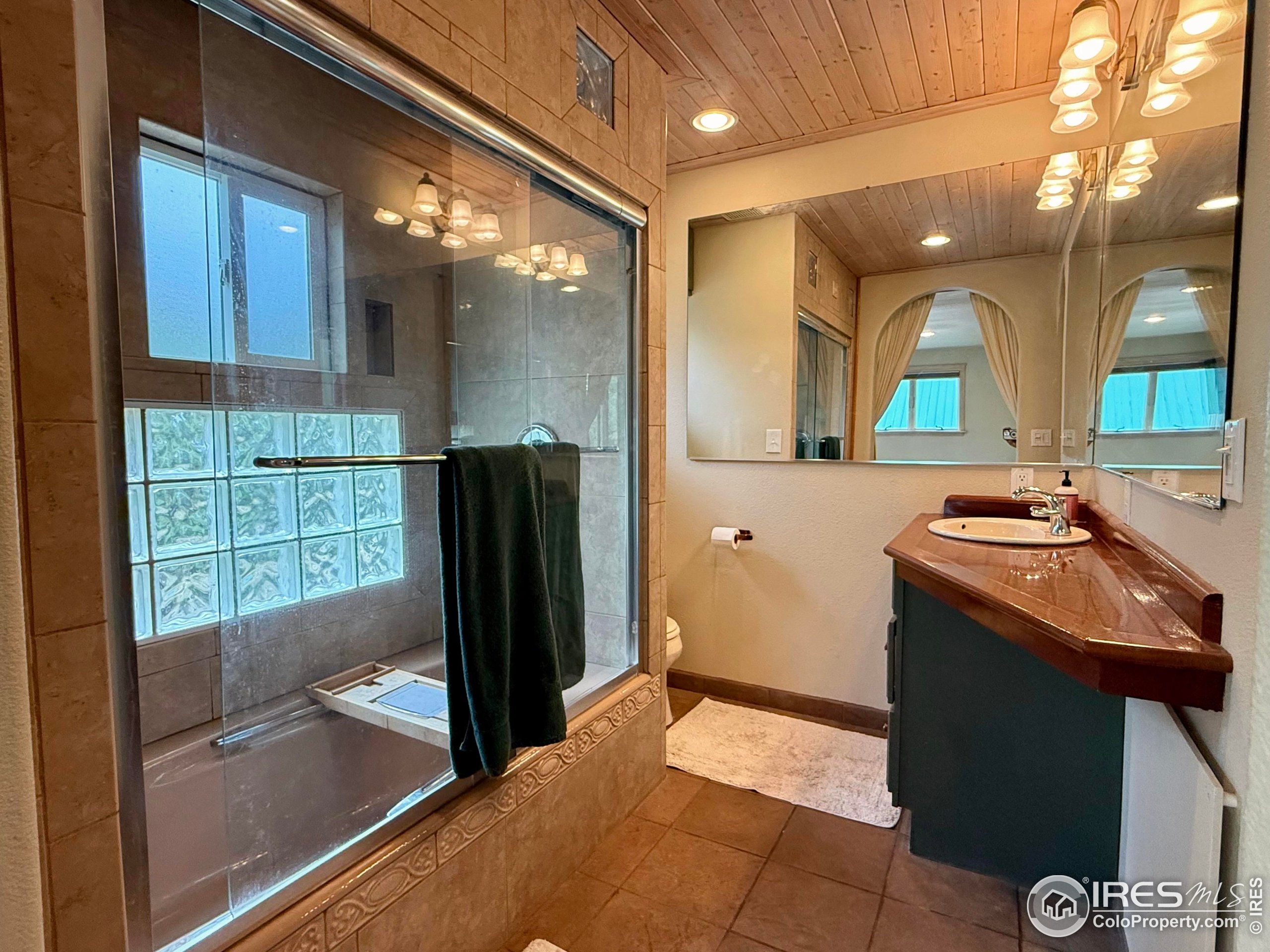 84 Ranch Road Ward, CO 80481 - Photo 16 of 45 a bathroom with a sink and a mirror