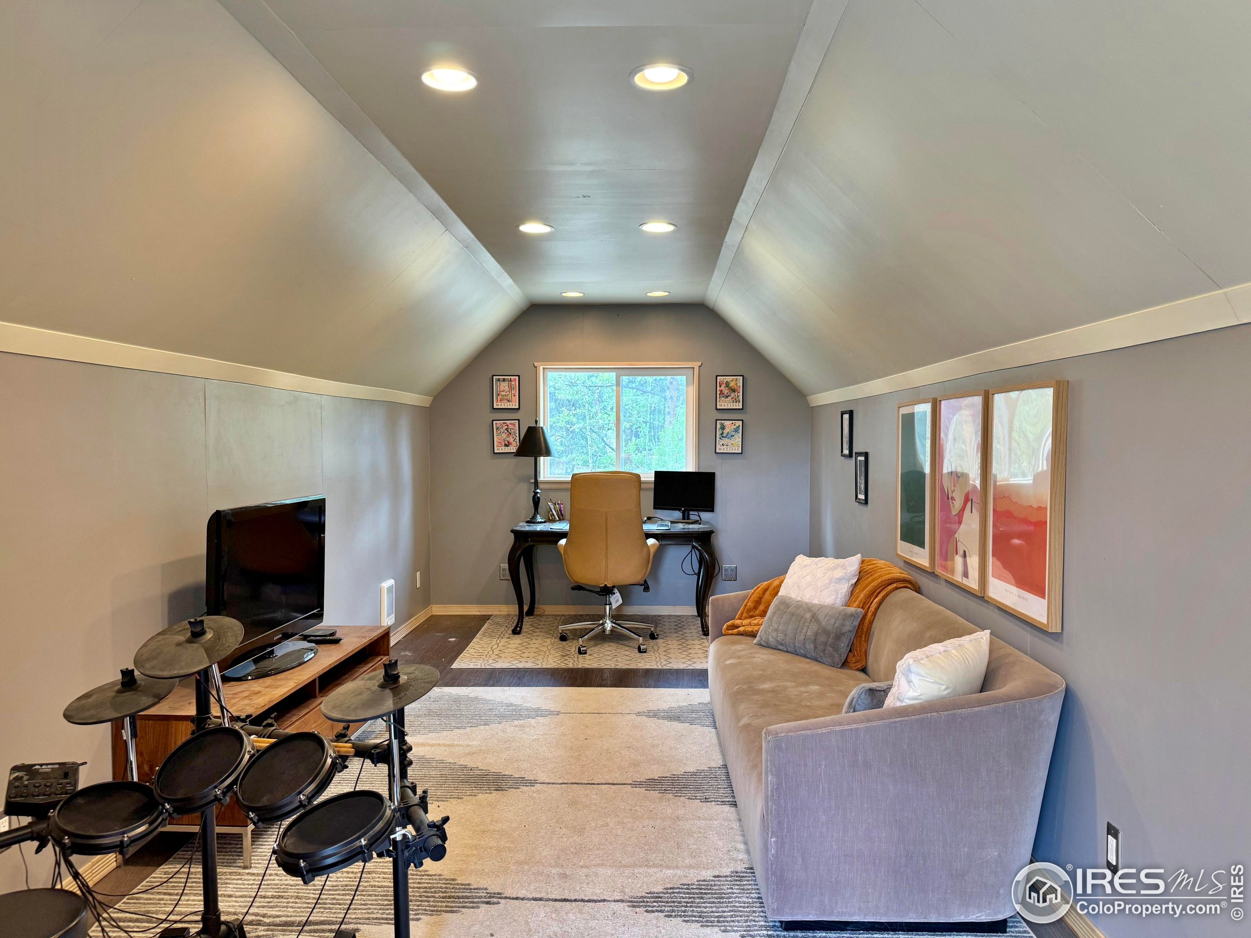 84 Ranch Road Ward, CO 80481 - Photo 25 of 45 a living room with furniture and a flat screen tv