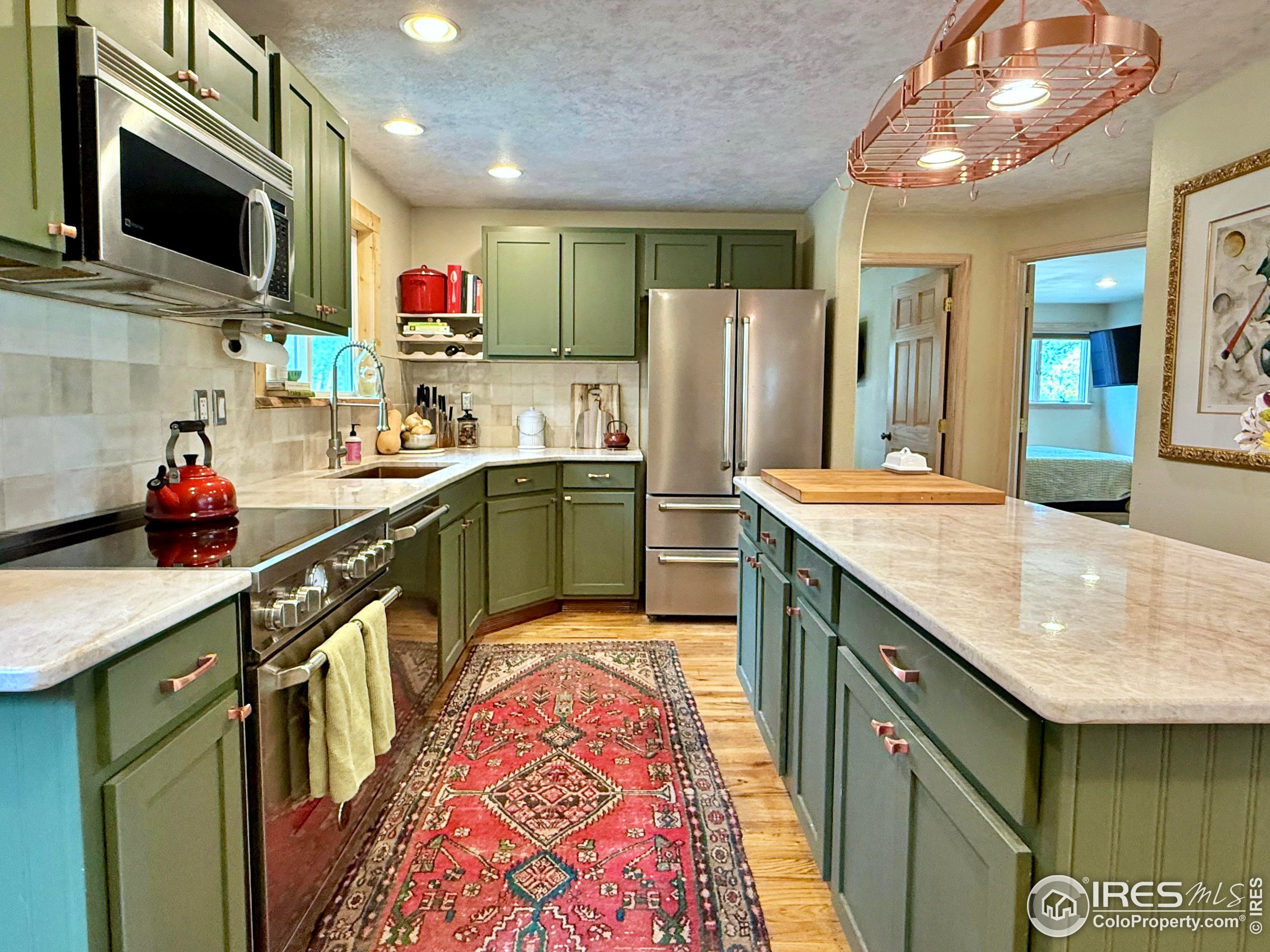84 Ranch Road Ward, CO 80481 - Photo 5 of 45 a kitchen with stainless steel appliances granite countertop a sink stove and refrigerator