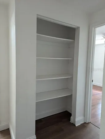 a storage room with wooden floor
