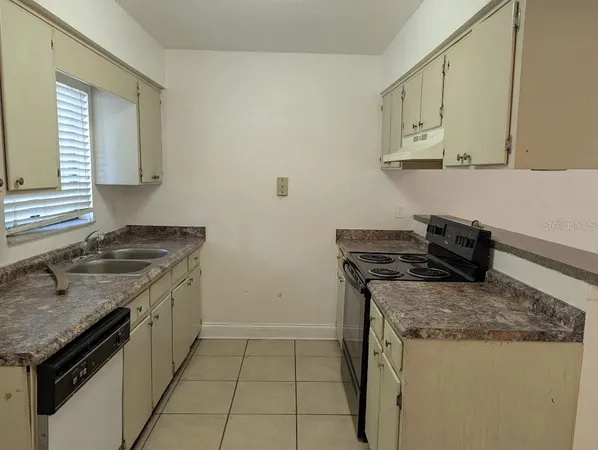 a kitchen with a stove and a sink