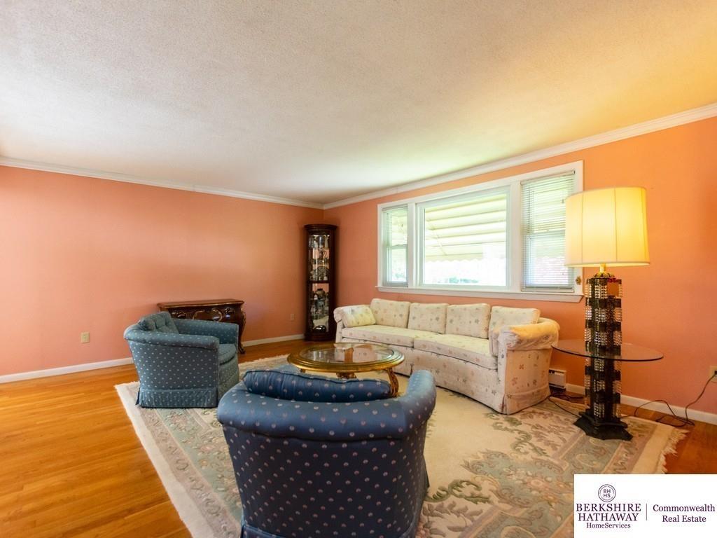 93 Graymore Road Waltham, MA 02451 - Photo 12 of 32 a living room with furniture and a table