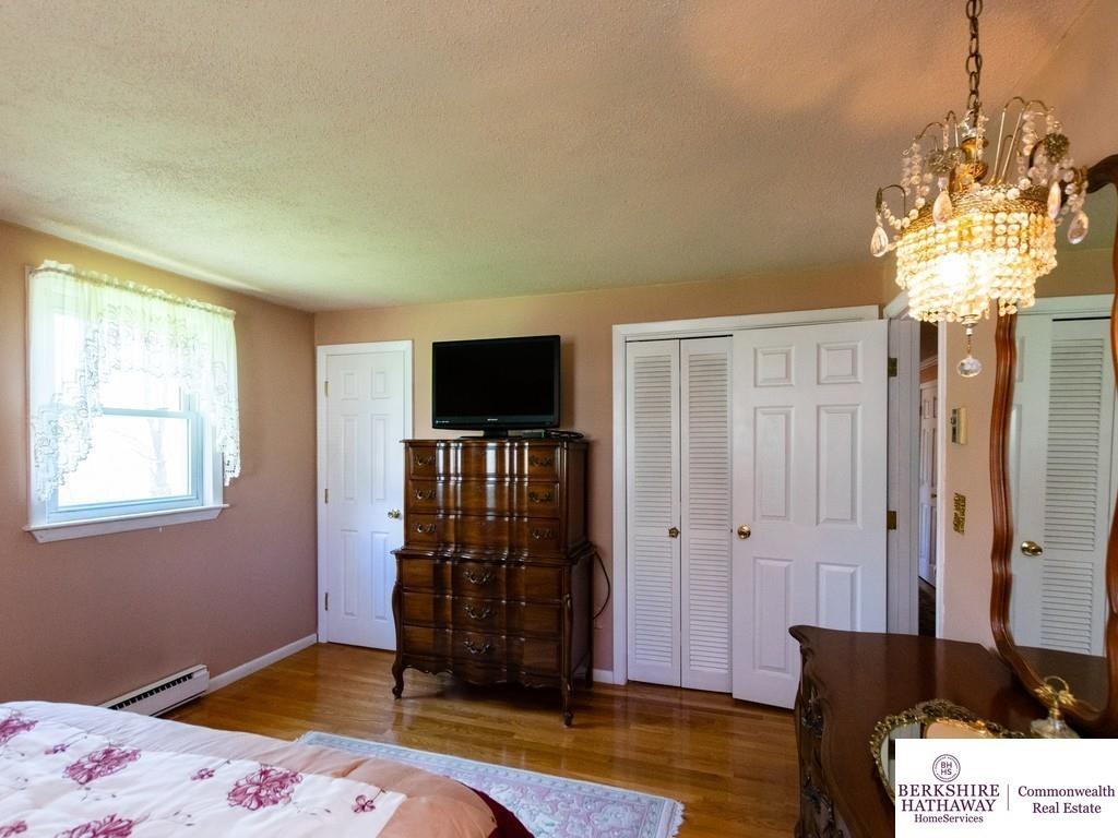 93 Graymore Road Waltham, MA 02451 - Photo 19 of 32 a bedroom with a bed and a window