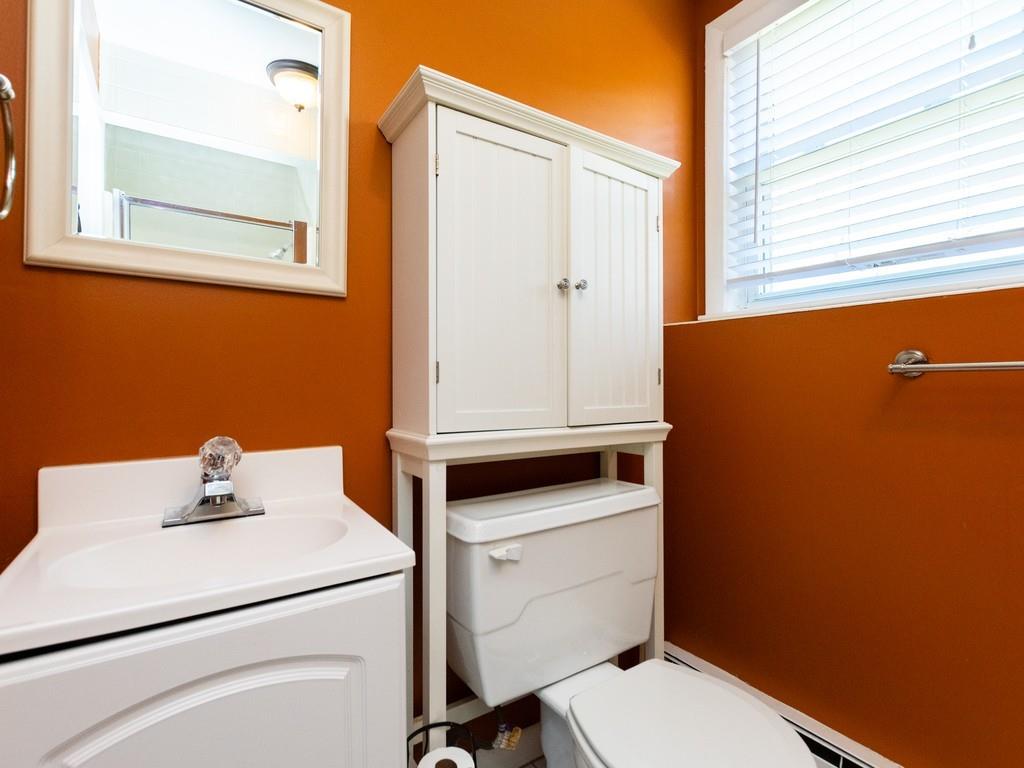 93 Graymore Road Waltham, MA 02451 - Photo 25 of 32 a bathroom with a sink toilet vanity and mirror