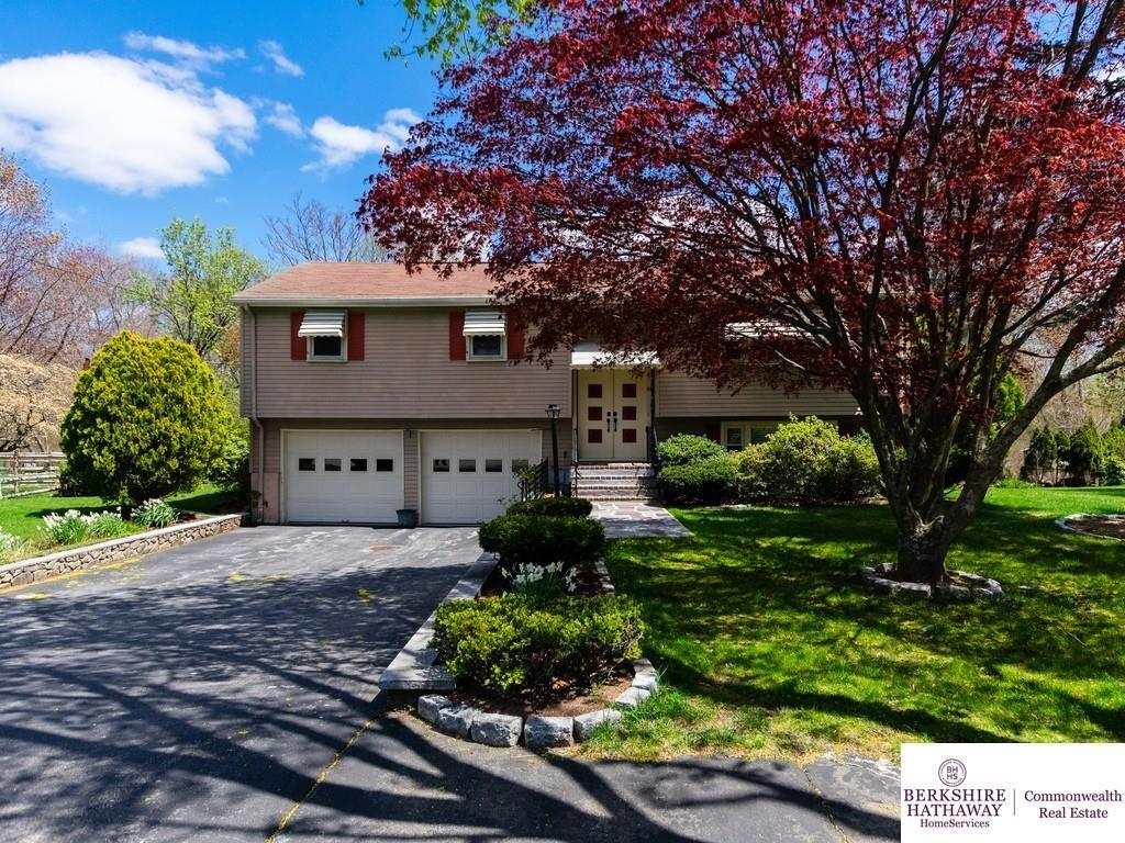93 Graymore Road Waltham, MA 02451 - Photo 3 of 32 a view of a house with a yard and potted plants