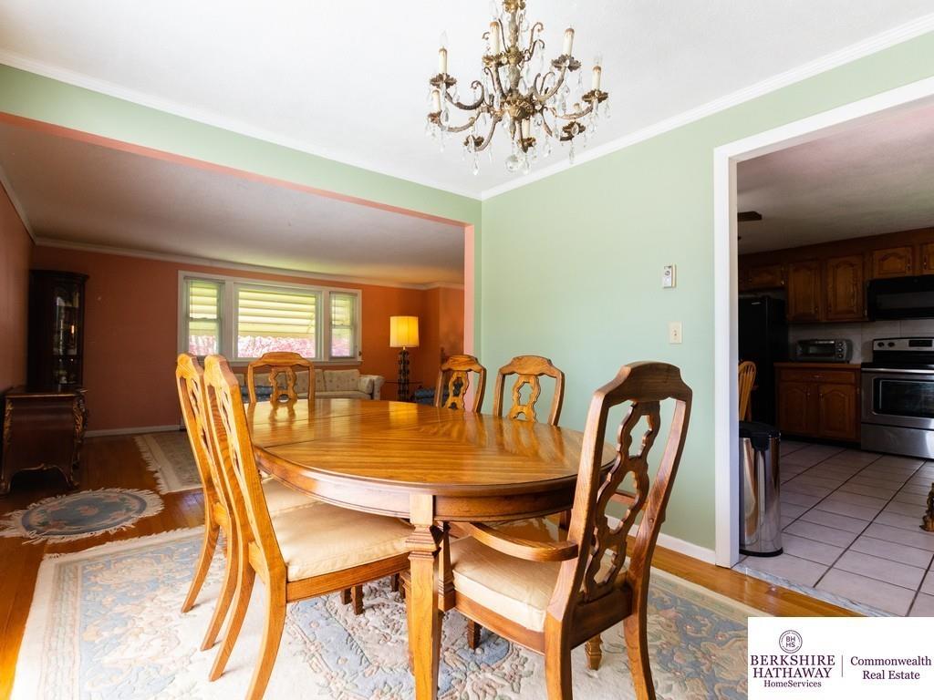 93 Graymore Road Waltham, MA 02451 - Photo 7 of 32 a dining room with furniture a chandelier and window