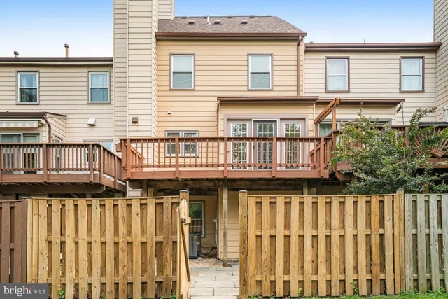 a view of a house with wooden deck