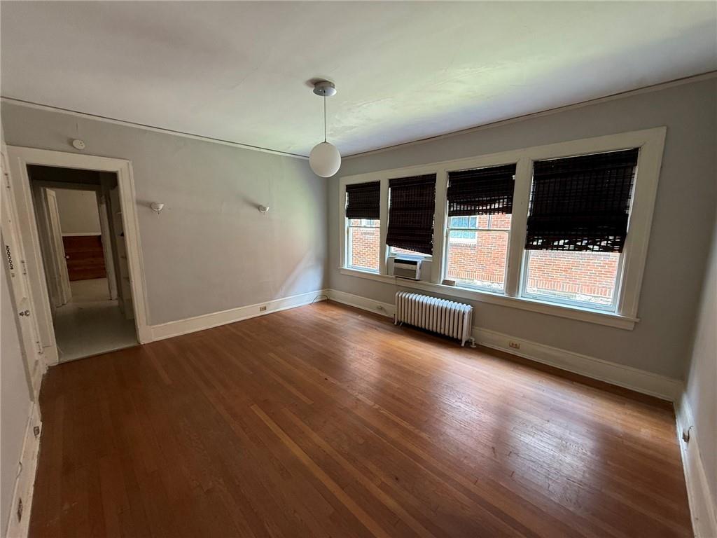 846 Briarcliff Road Northeast Atlanta, GA 30306 - Photo 14 of 22 an empty room with wooden floor and windows