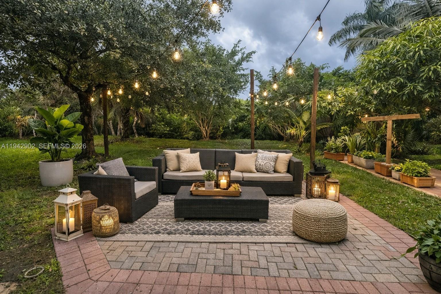 16276 Southwest 26th Street Miramar, FL 33027 - Photo 7 of 8 a outdoor living space with furniture and garden