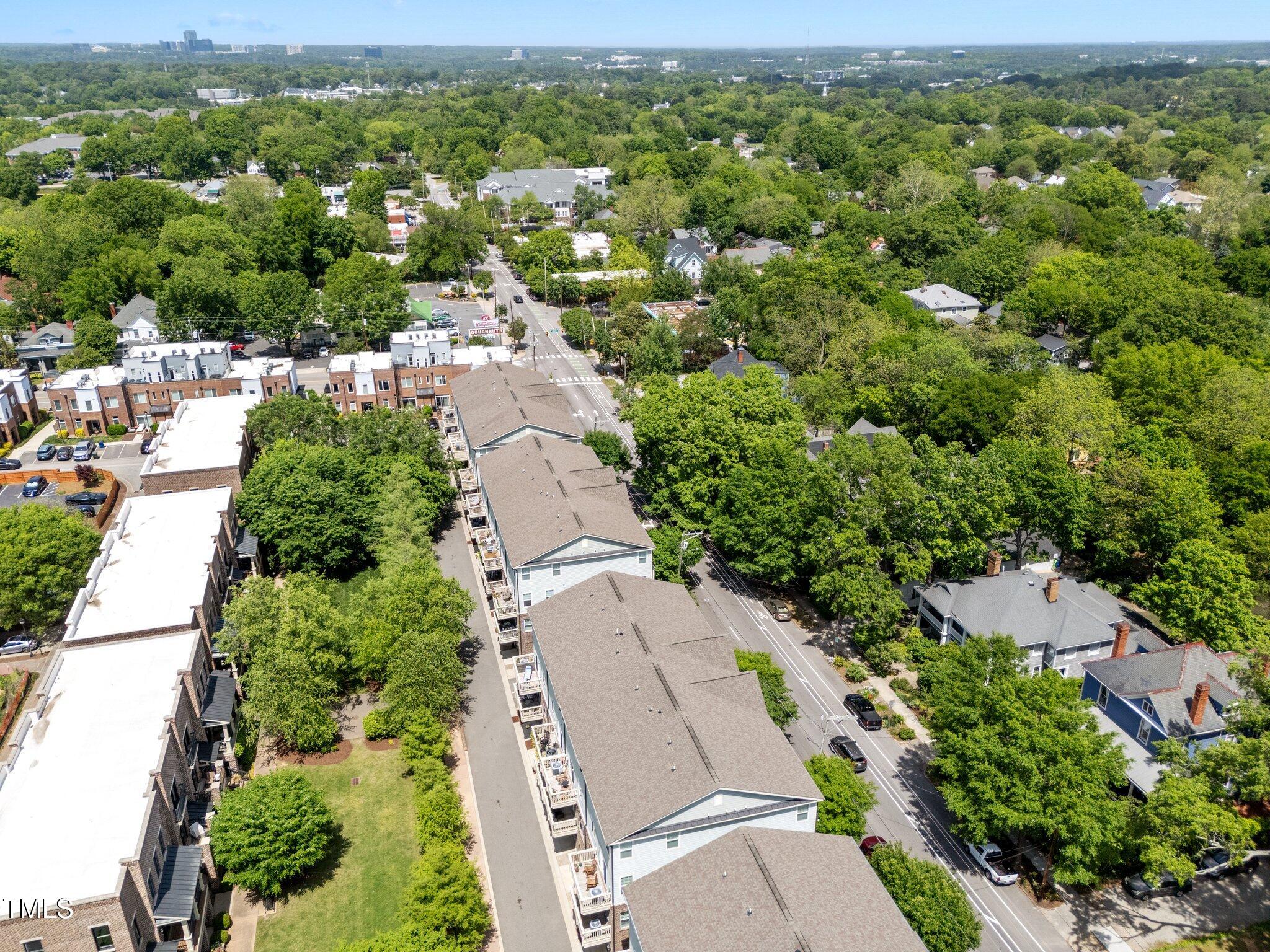 511 North Person Street, Unit 101 Raleigh, NC 27604 - Photo 28 of 35 an aerial view of a city with lots of residential buildings