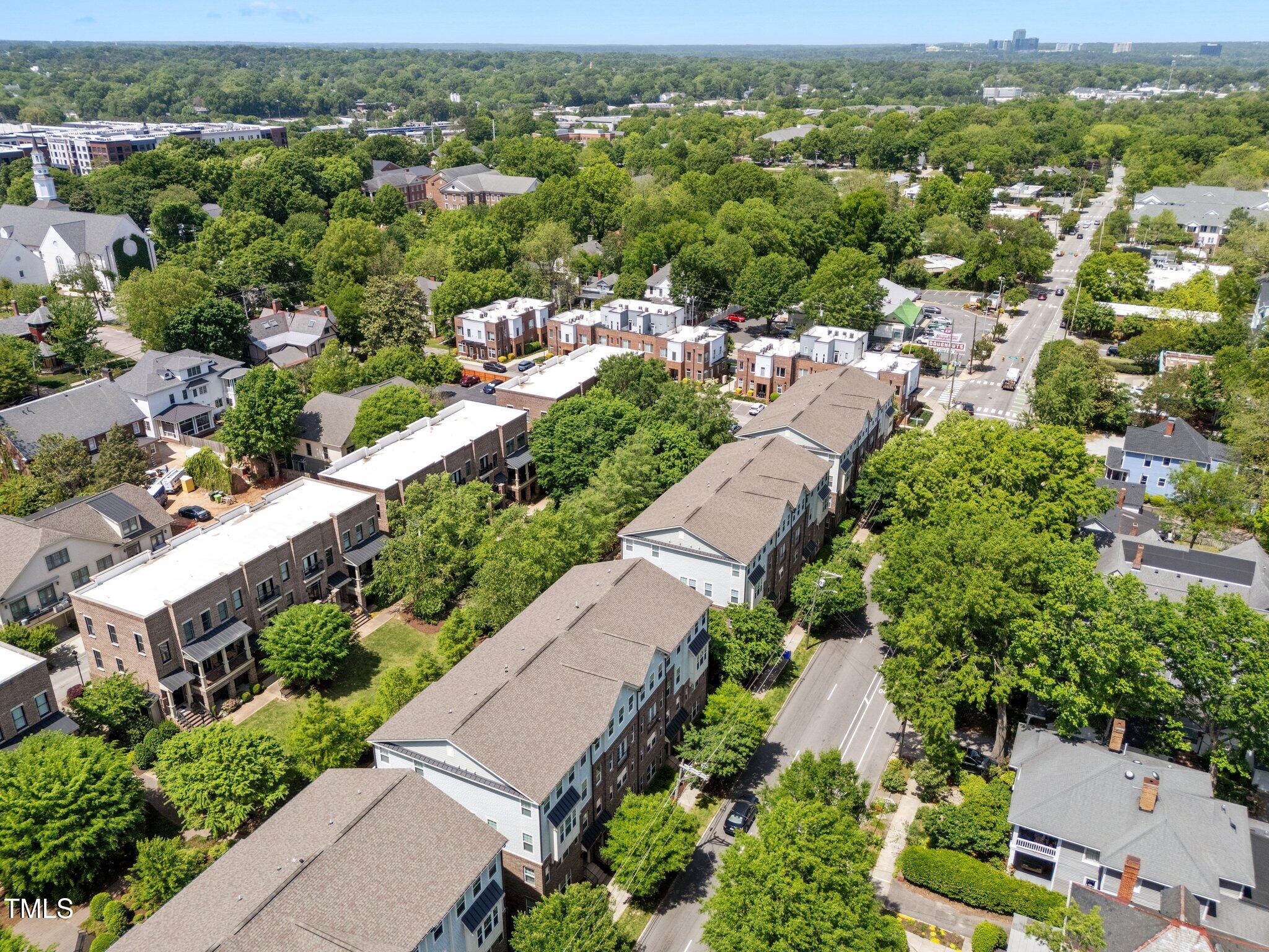 511 North Person Street, Unit 101 Raleigh, NC 27604 - Photo 29 of 35 an aerial view of residential houses with outdoor space