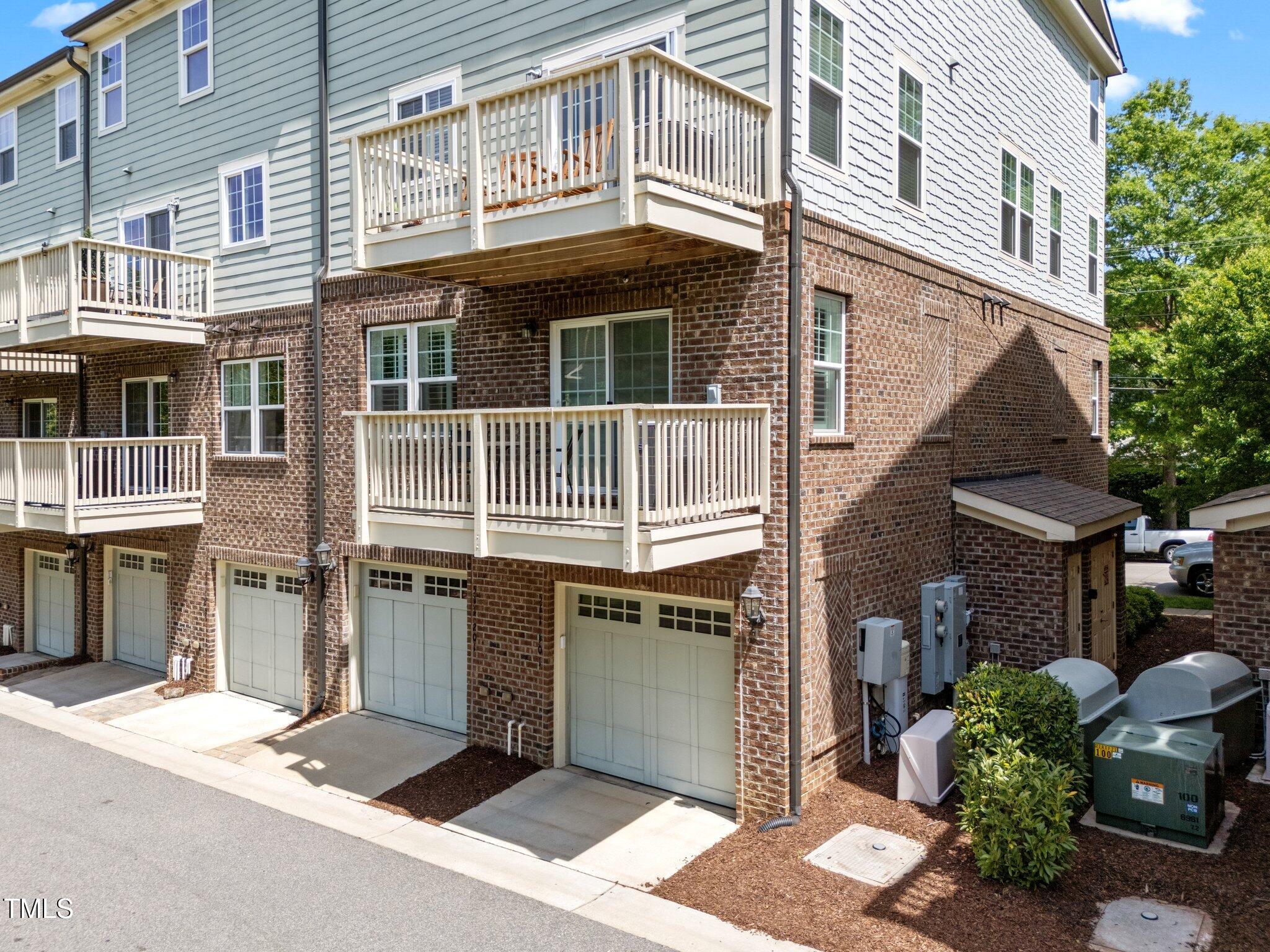 511 North Person Street, Unit 101 Raleigh, NC 27604 - Photo 32 of 35 a front view of a building with a garden