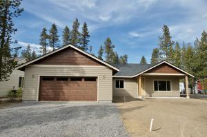 56025 Marsh Hawk Road Bend, OR 97707 - Photo 1 of 4 a front view of a house with a garage