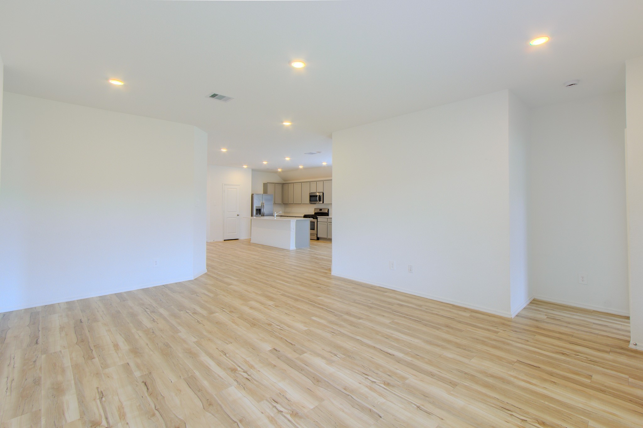 3113 Catalonion Court Conroe, TX 77301 - Photo 18 of 45 a view of empty room with wooden floor