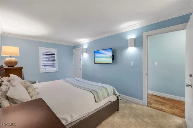 a bedroom with a bed and night stand