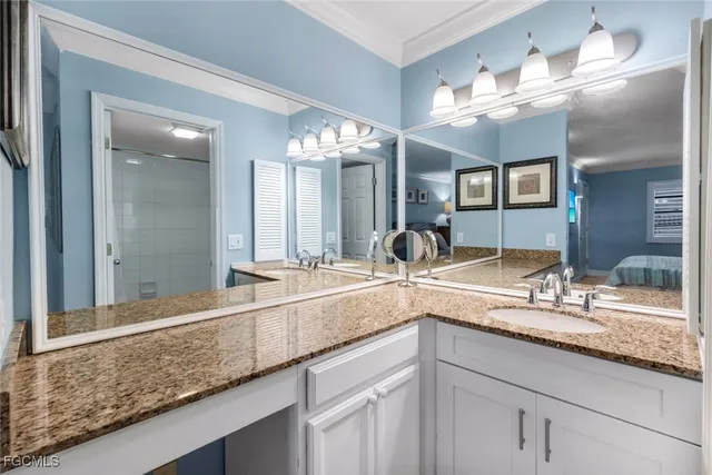 a bathroom with a sink and a large mirror