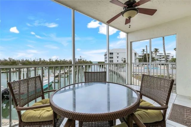 a view of a balcony dining area with furniture