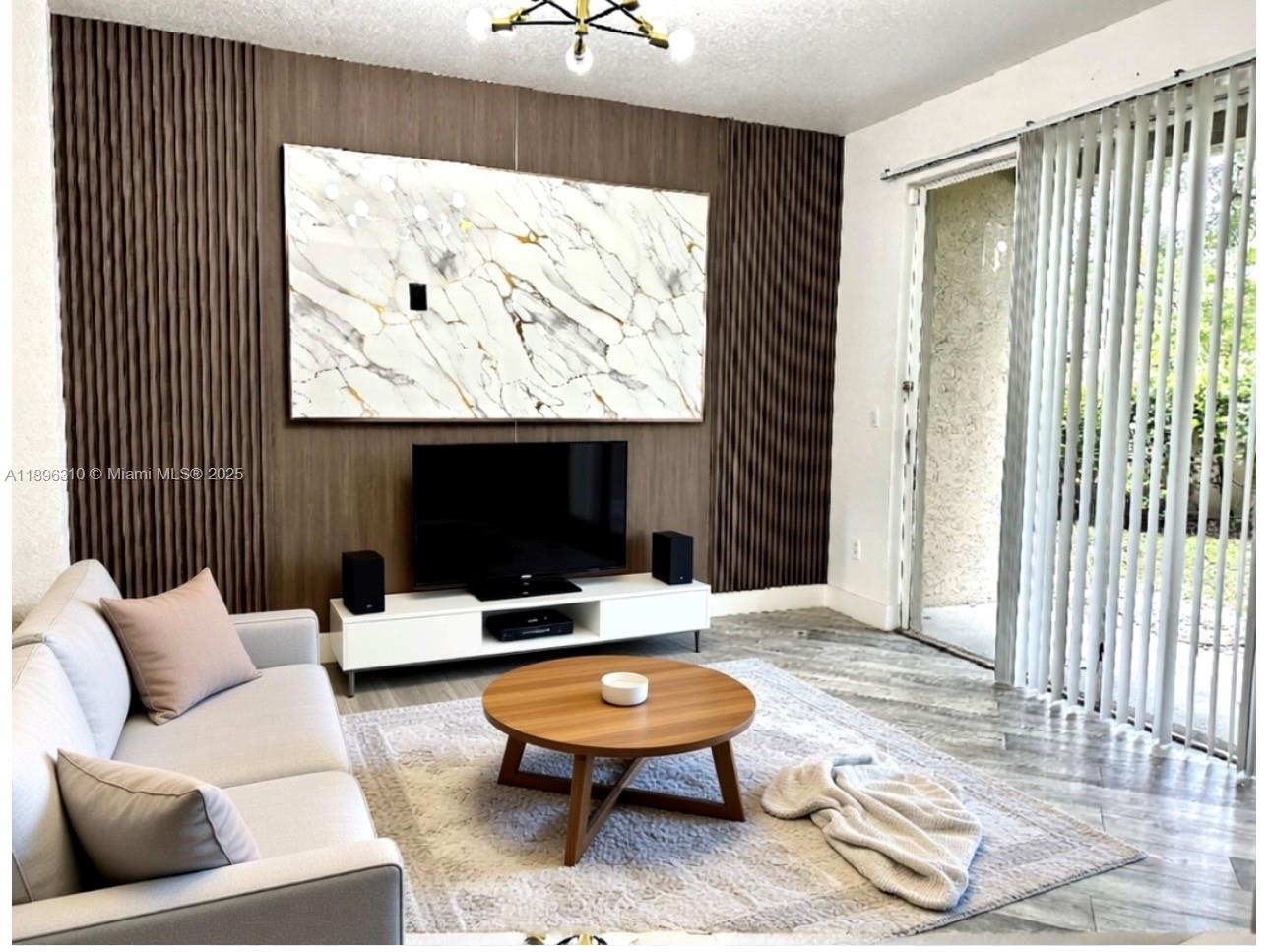 a living room with furniture and a flat screen tv